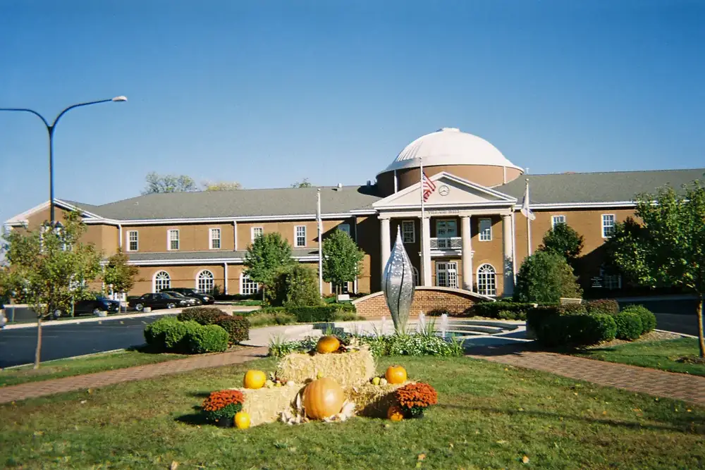 Domed Addison Village Hall with a fall display of pumpkins on the lawn, Illinois