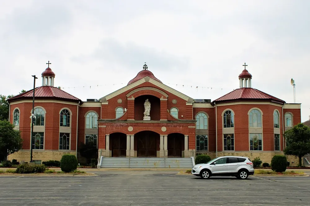 Red-brick Mar Thoma Sleeha Cathedral with domed towers in Bellwood, Illinois