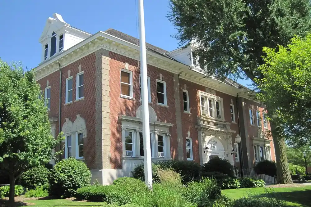 Brick and stone Lyons Township Hall with a white cupola in La Grange, Illinois