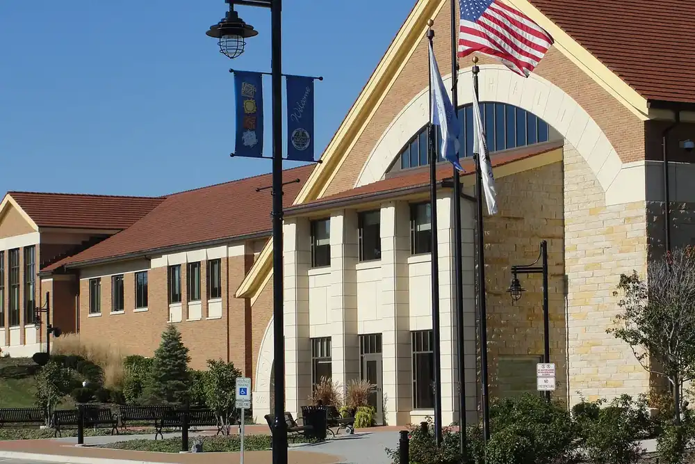 Montgomery Village Hall with flags and banners on a sunny day, Illinois