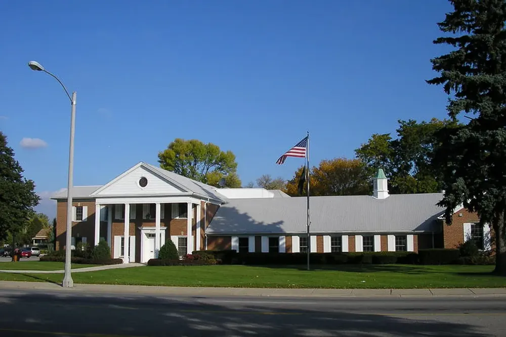 Colonial-style Morton Grove Civic Center with white columns and a flag, Illinois