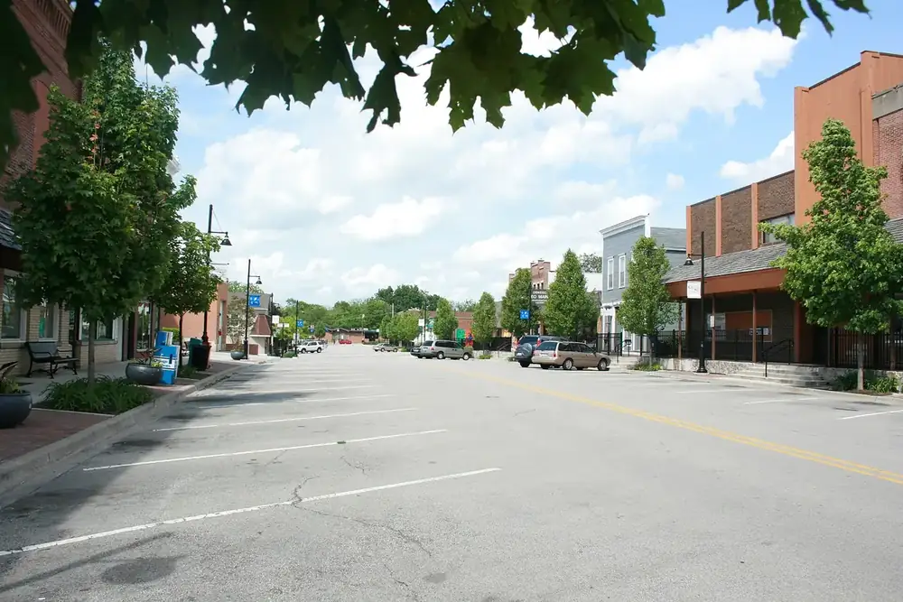 Quiet tree-lined Main Street in downtown Oswego on a summer day, Illinois