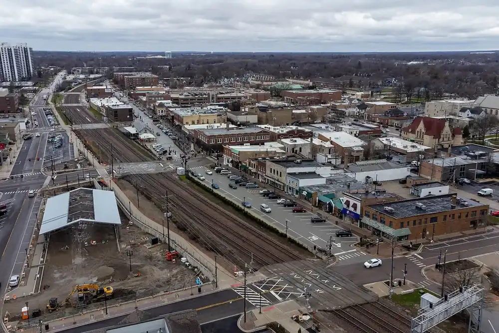 Aerial view of downtown Wheaton and the railroad line on a cloudy day, Illinois